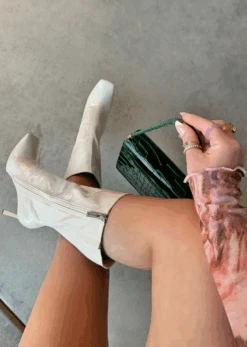 STEAL THE NIGHT OFF WHITE PATENT BOOT -LOLE OUTLET ScreenShot2022 01 18at11.19.09PM